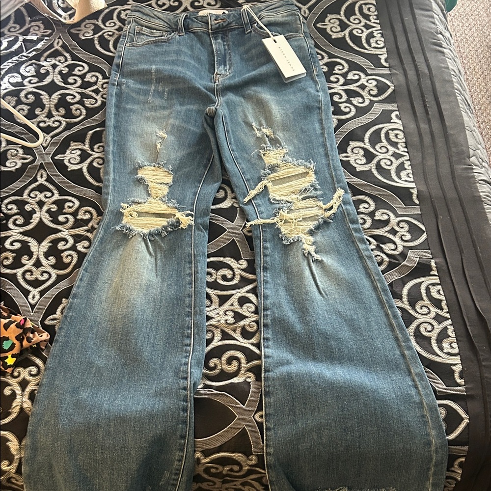 Trendy Distressed Flare Jeans in Blue